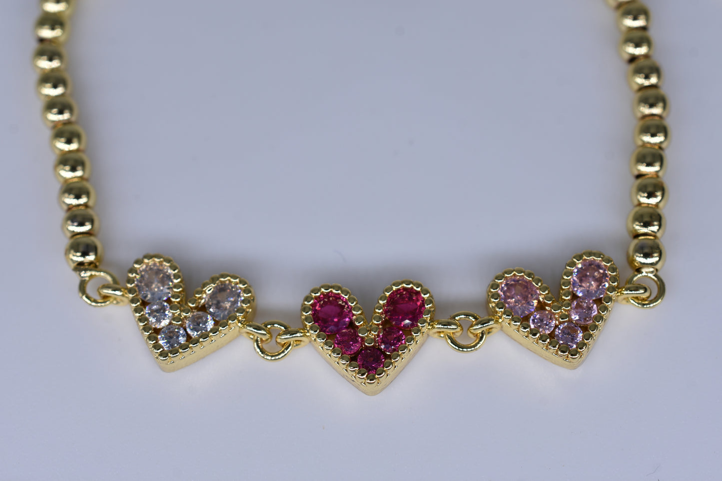 3 Hearts With Pink/Hot Pink Diamonds Gold